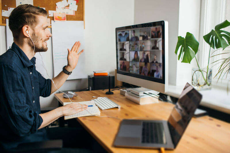 Alt: Man greeting during video call