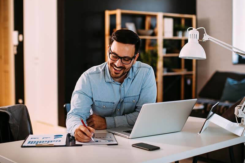 Woman smiling with laptop